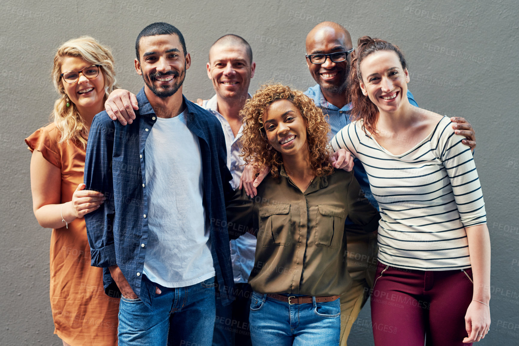 Buy stock photo Happy business people, portrait and diversity with unity for company growth together on a wall background. Group of diverse or young employees with smile teamwork for creative startup or about us
