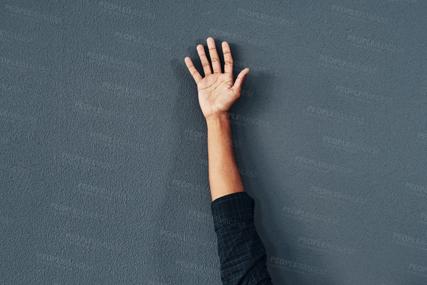 Buy stock photo Studio shot of an unrecognizable woman raising her hand against a grey background