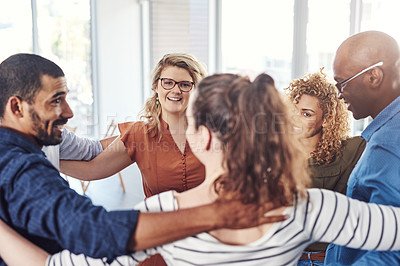 Buy stock photo Shot of a group of people standing in a circle together