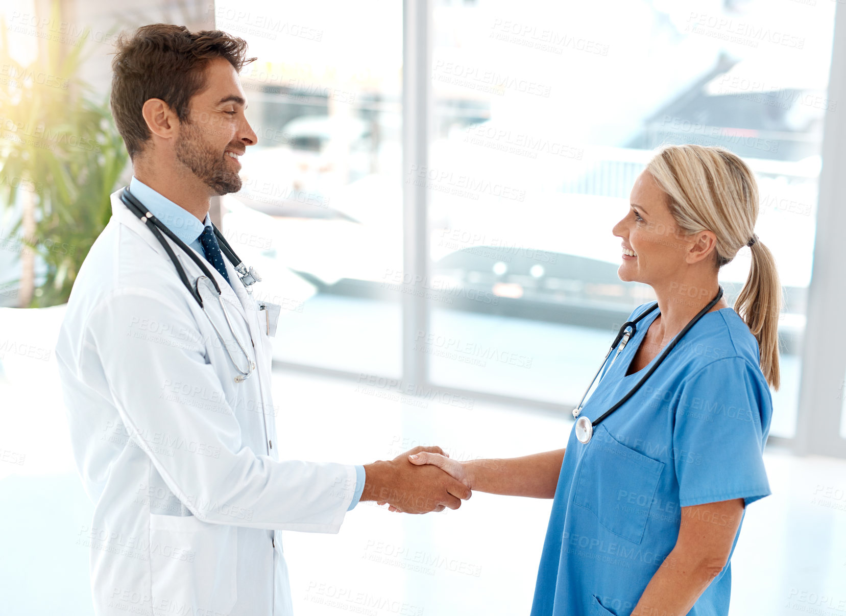 Buy stock photo Doctor, nurse and handshake for achievement, partnership or congratulations at work. Medical professional, people and well done for research, surgery and success in hospital or clinic in internship