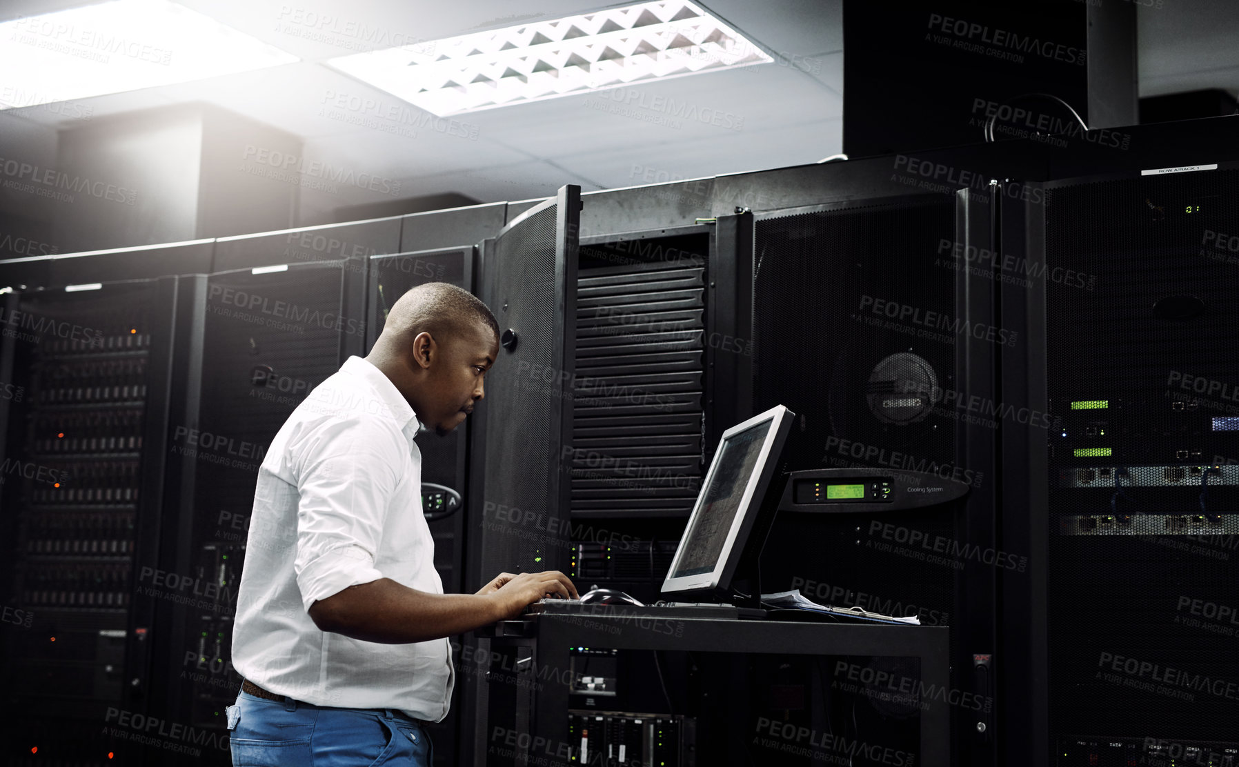 Buy stock photo Server room, black man or coding on computer for programming or digital error in data center. Cybersecurity, support or technician typing online for fixing, troubleshooting or software development