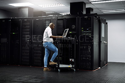 Buy stock photo IT support, black man or coding on computer in server room for big data, network glitch or digital website. Code, fixing or technician typing on laptop testing UX, programming or software development
