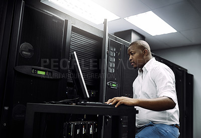 Buy stock photo IT support, black man or coding on laptop in server room for big data, network glitch or digital website. Code, fixing or technician typing on computer testing UX, programming or software development