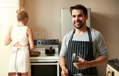 Buy stock photo Cropped portrait of a handsome young man and his girlfriend preparing food together at home