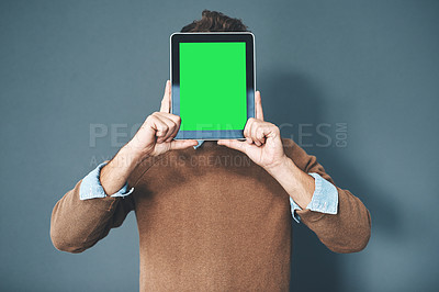 Buy stock photo Tablet with green screen, chroma key and copy space held by man against grey background. Technology and advertising or marketing of a digital business at a workplace. Creativity online and innovation