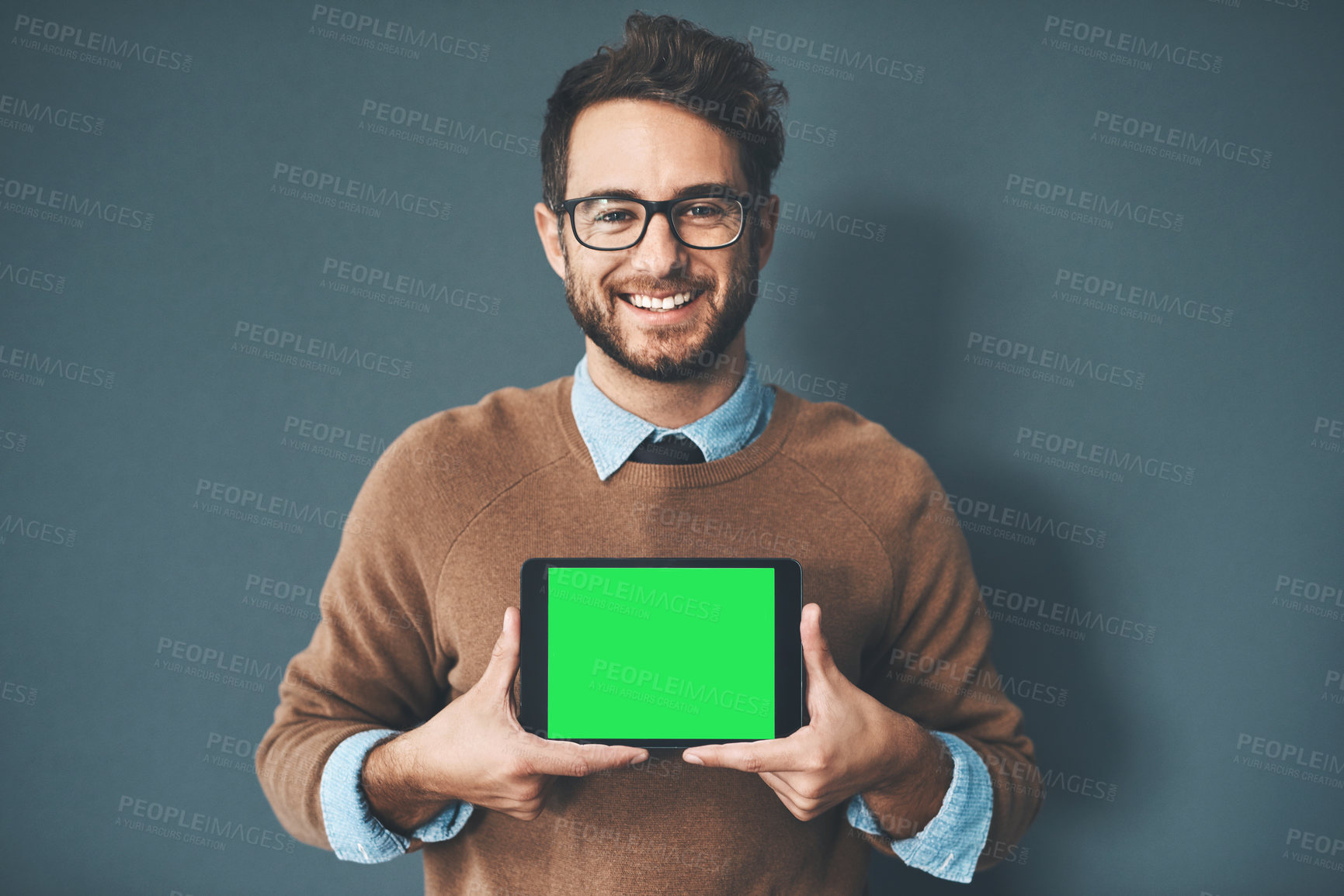 Buy stock photo Green screen, copy space and chroma key on tablet monitor for website, marketing and promotion. Portrait of smiling, happy and excited web designer showing new webpage and app on technology in studio
