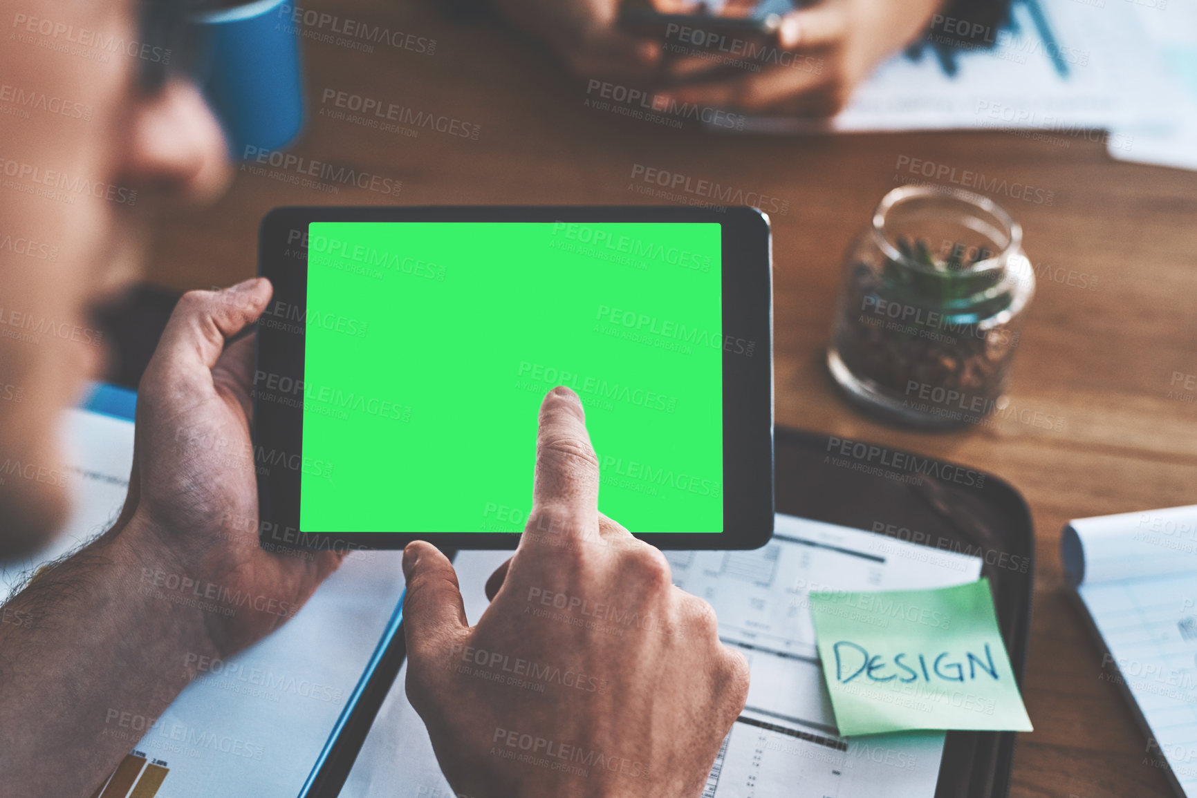 Buy stock photo Advert for marketing with a green screen, chroma key and copy space. Creative digital networking on a tablet with a business man in a meeting. Professional designer discussing vision for new design 