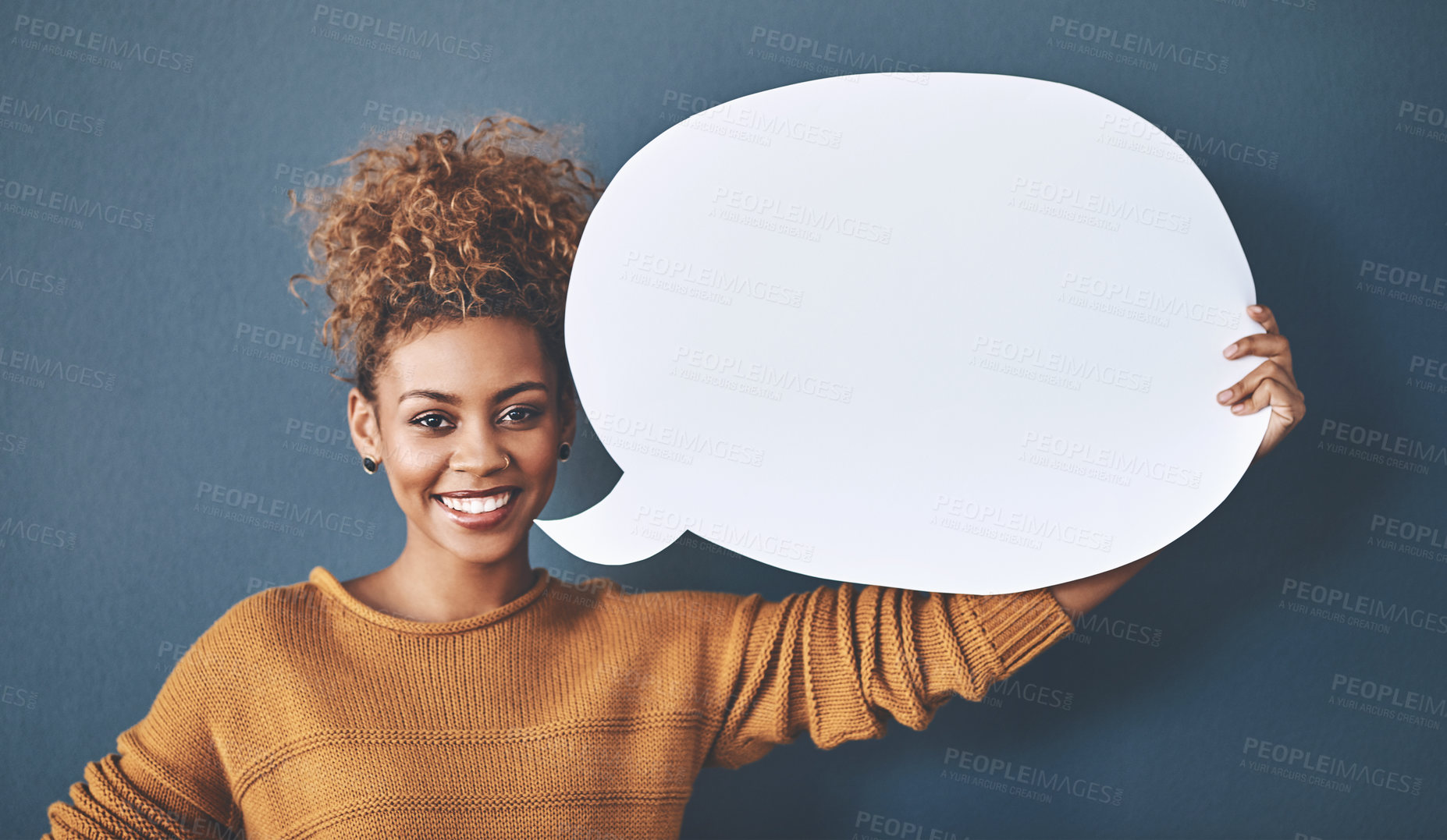 Buy stock photo Happy woman, portrait and comment with speech bubble for social media or feedback in studio on a blue background. Female person or model with smile or sign for vote, review or message on mockup space