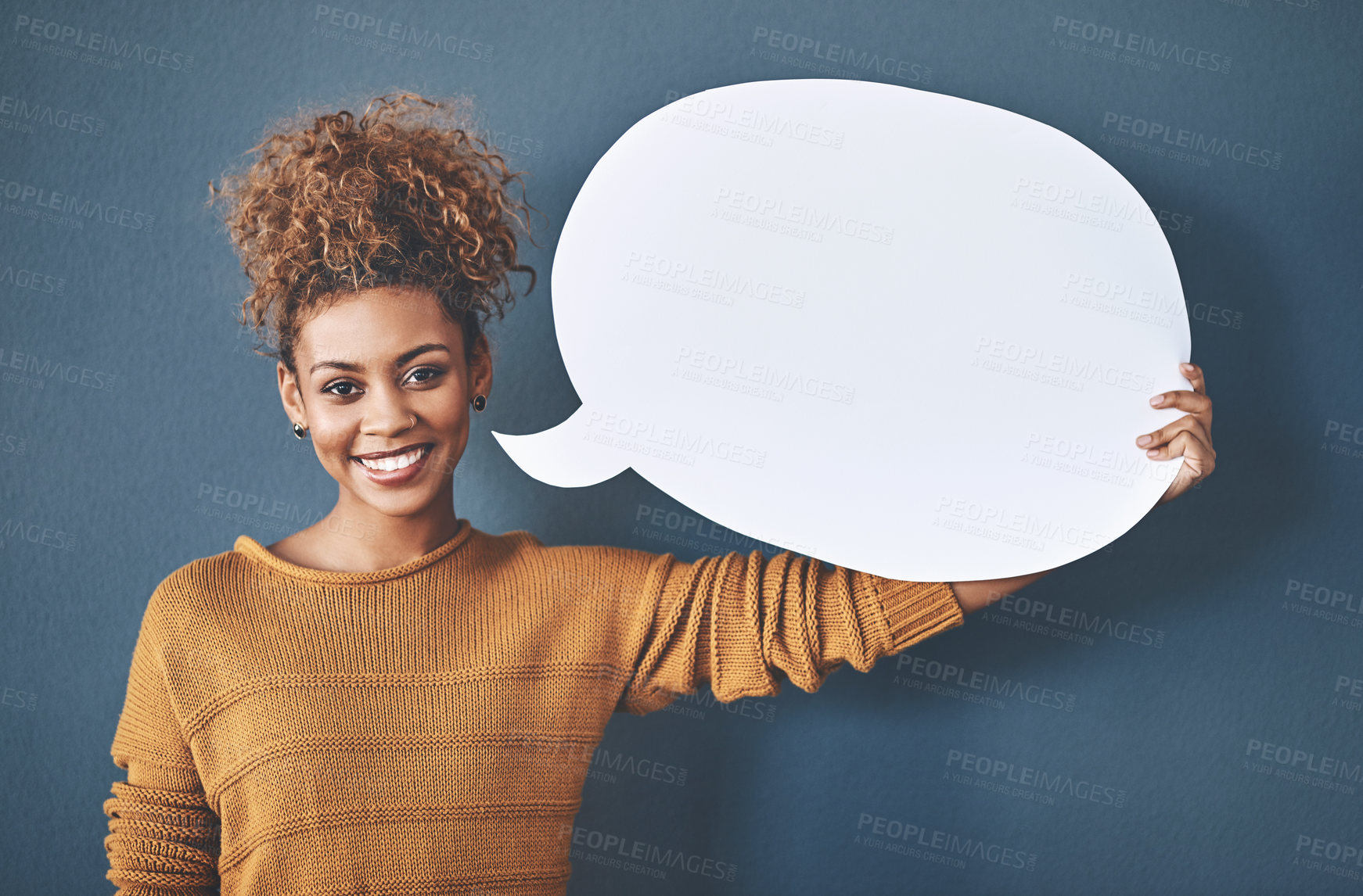 Buy stock photo Happy woman, portrait and social media with speech bubble for message, feedback or comment in studio on a blue background. Female person or model with smile or sign for vote or review on mockup space