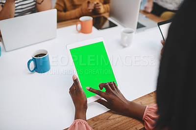 Buy stock photo Shot of a businesswoman using a digital tablet during a meeting in a modern office