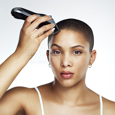 Buy stock photo Studio shot of a beautiful young woman shaving her head against a white background