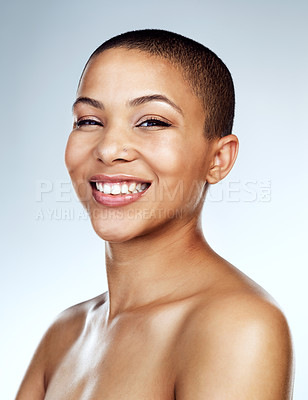Buy stock photo Studio shot of a beautiful young woman smiling against a grey background