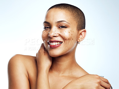 Buy stock photo Studio shot of a beautiful young woman posing with glitter freckles on her face