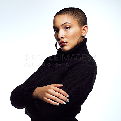 Buy stock photo Studio shot of an attractive young woman posing with her arms folded against a grey background