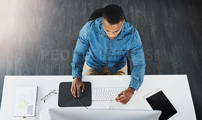 Buy stock photo Top view, business and black man with computer in office for  project planning, online marketing or proposal at desk. Lens flare, employee and technology for reading email, report or graphic designer