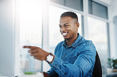Buy stock photo Pointing, smile and black man by computer in office, workspace and desk happy in creative career. Happiness, internship and journalist with technology for typing, research and internet for working