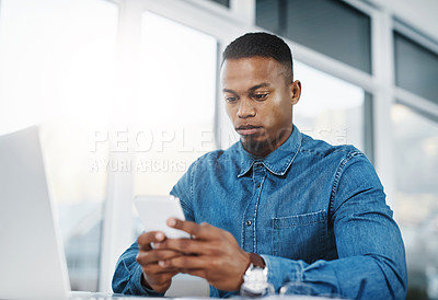Buy stock photo Typing, cellphone and black man by computer in office, workspace and desk happy in creative career. Communication, internship and journalist with tech for contact, research and internet for working