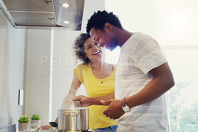 Buy stock photo Cooking, love and happy with couple in kitchen for bonding, breakfast and morning. Happiness, smile and food with man and woman preparing meal together at home for relax, nutrition and wellness