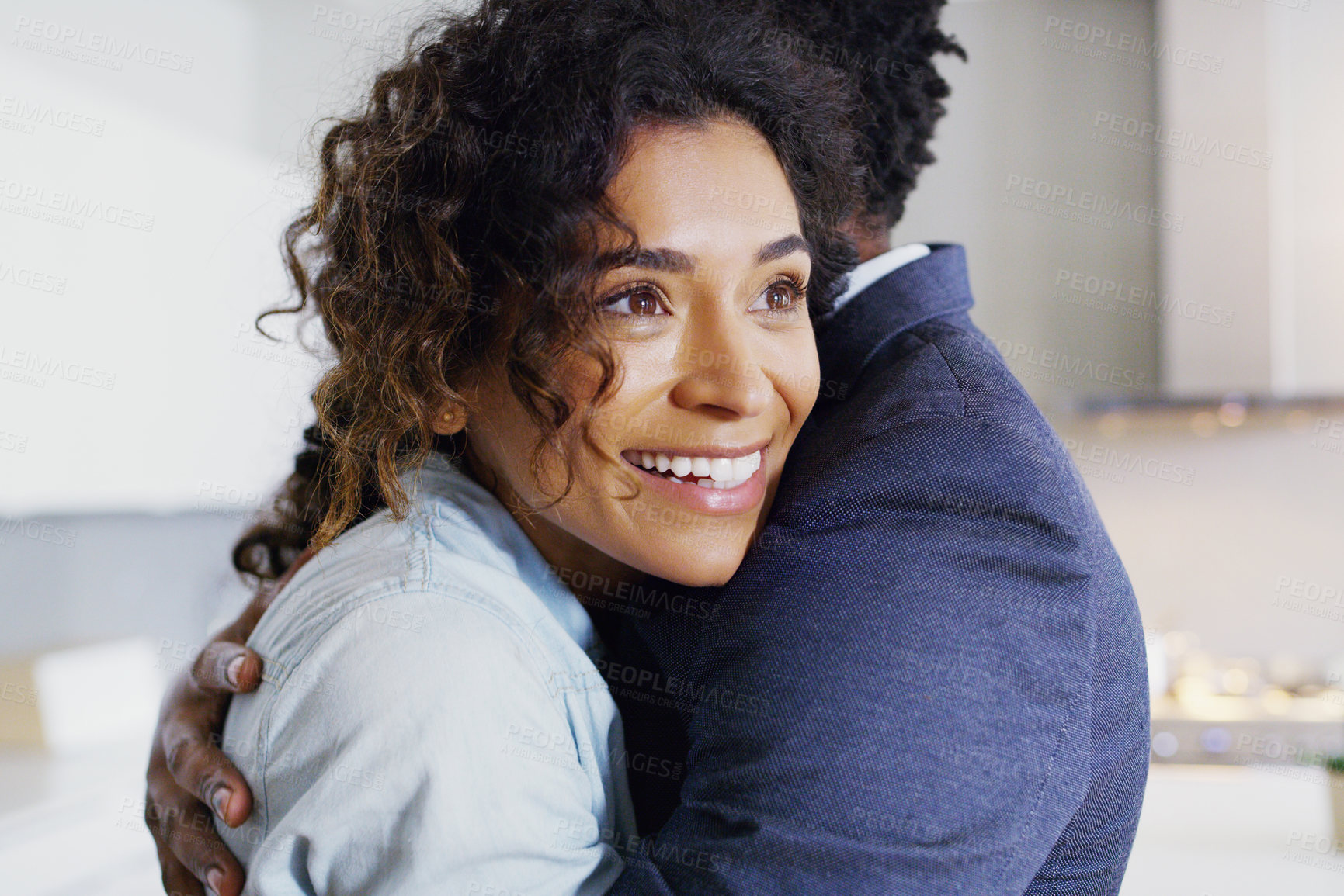 Buy stock photo Couple, hug and smile in home with love, care and connection with reunion, bonding and thinking. African woman, man and partner with embrace, happy and security in relationship for trust in apartment