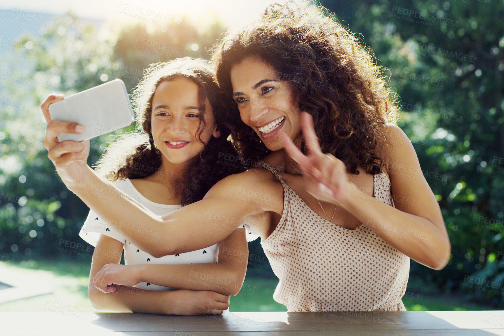 Buy stock photo Mother, girl kid and selfie in garden with peace sign, happiness or smile in summer sunshine. Young mom, daughter and profile picture for social media, app or blog in backyard with bond, love or care
