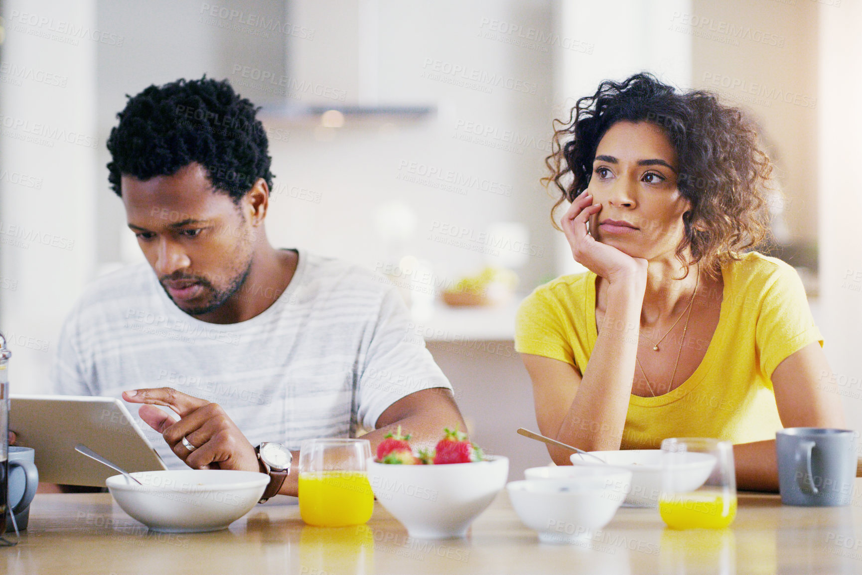 Buy stock photo Technology, breakfast and man ignore woman for social media, reading news and digital app in morning. Marriage, couple and sad female and male on tablet with relationship problem, ignoring and issues