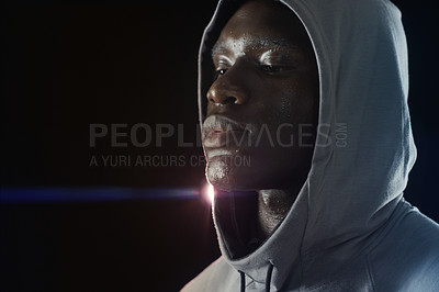 Buy stock photo Fitness, workout and face of black man with sweat in dark for running, exercise and marathon training. Sports mockup, thinking and serious male person in hoodie with dedication, motivation and focus