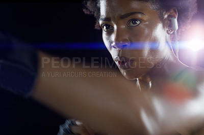 Buy stock photo Black woman, athlete and boxing punch with arm on dark background for night training, earphones or sweat. Female person, fitness and professional martial arts or self defense class, fight or sport