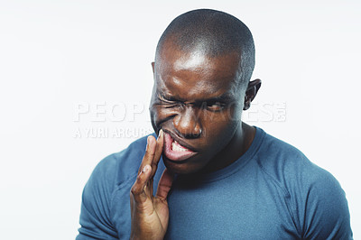 Buy stock photo Toothache, pain and black man on a white background for dental crisis, gum disease or inflammation. Dentist, healthcare and isolated person with cavity in studio for gingivitis, oral care or bacteria