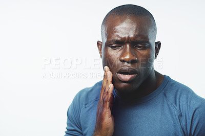 Buy stock photo Toothache, pain and black man in studio for dental crisis, gum disease or inflammation. Dentist, healthcare and isolated person with cavity for gingivitis, oral care or bacteria on white background