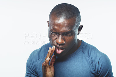 Buy stock photo Toothache, pain and black man on a white background for medical crisis, gum disease or dental hygiene. Dentist, healthcare and isolated person with cavity in studio for gingivitis, oral or bacteria