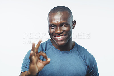 Buy stock photo Okay sign, fitness and portrait of black man on a white background for training, workout and exercise. Sports, emoji and happy personal trainer for gym promotion, like and yes to wellness in studio