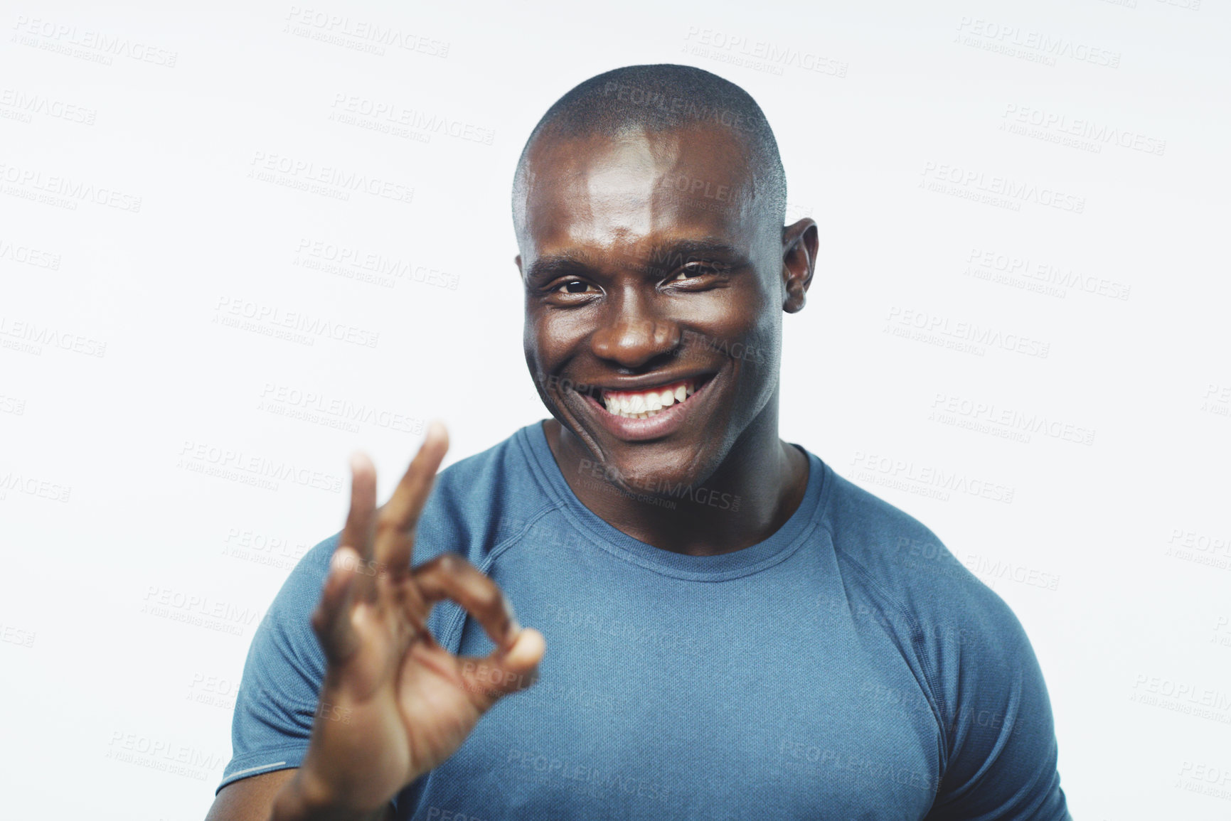 Buy stock photo Okay sign, fitness and portrait of black man on a white background for training, workout and exercise. Sports, emoji and happy personal trainer for gym promotion, like and yes to wellness in studio