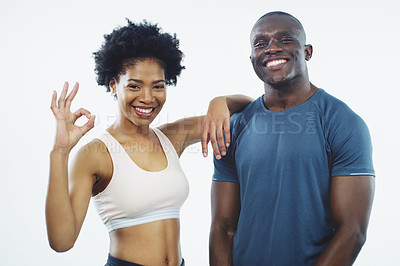 Buy stock photo Studio shot of two young athletes posing together against a grey background