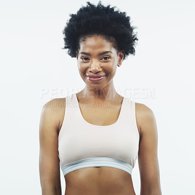 Buy stock photo Studio shot of an attractive young female athlete posing against a grey background