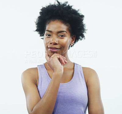Buy stock photo Studio shot of an attractive young woman posing with her hand on her face against a grey background