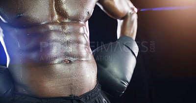 Buy stock photo Studio shot of an unrecognizable shirtless sportsman posing against a dark background