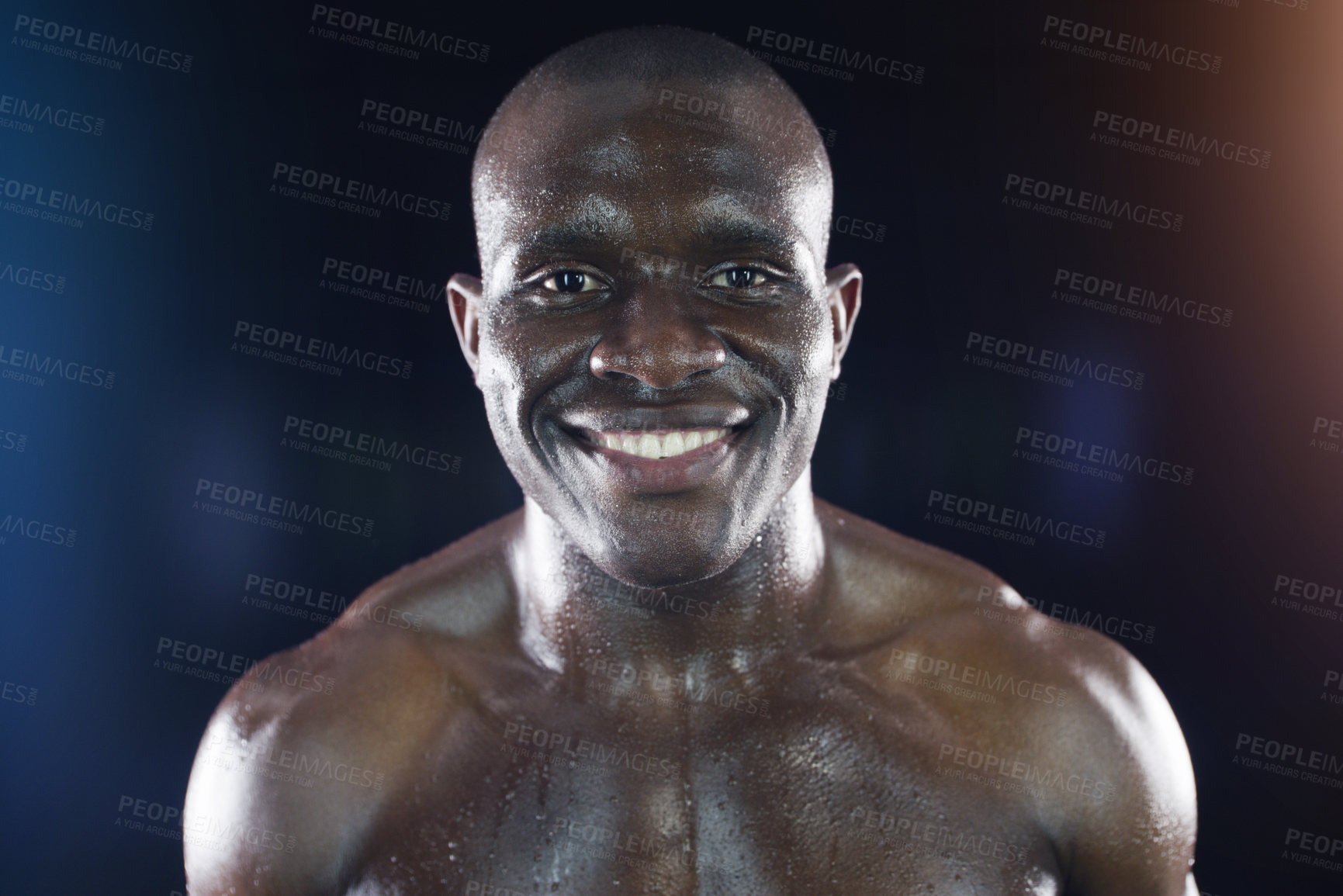 Buy stock photo Studio shot of a young sportsman posing against a dark background