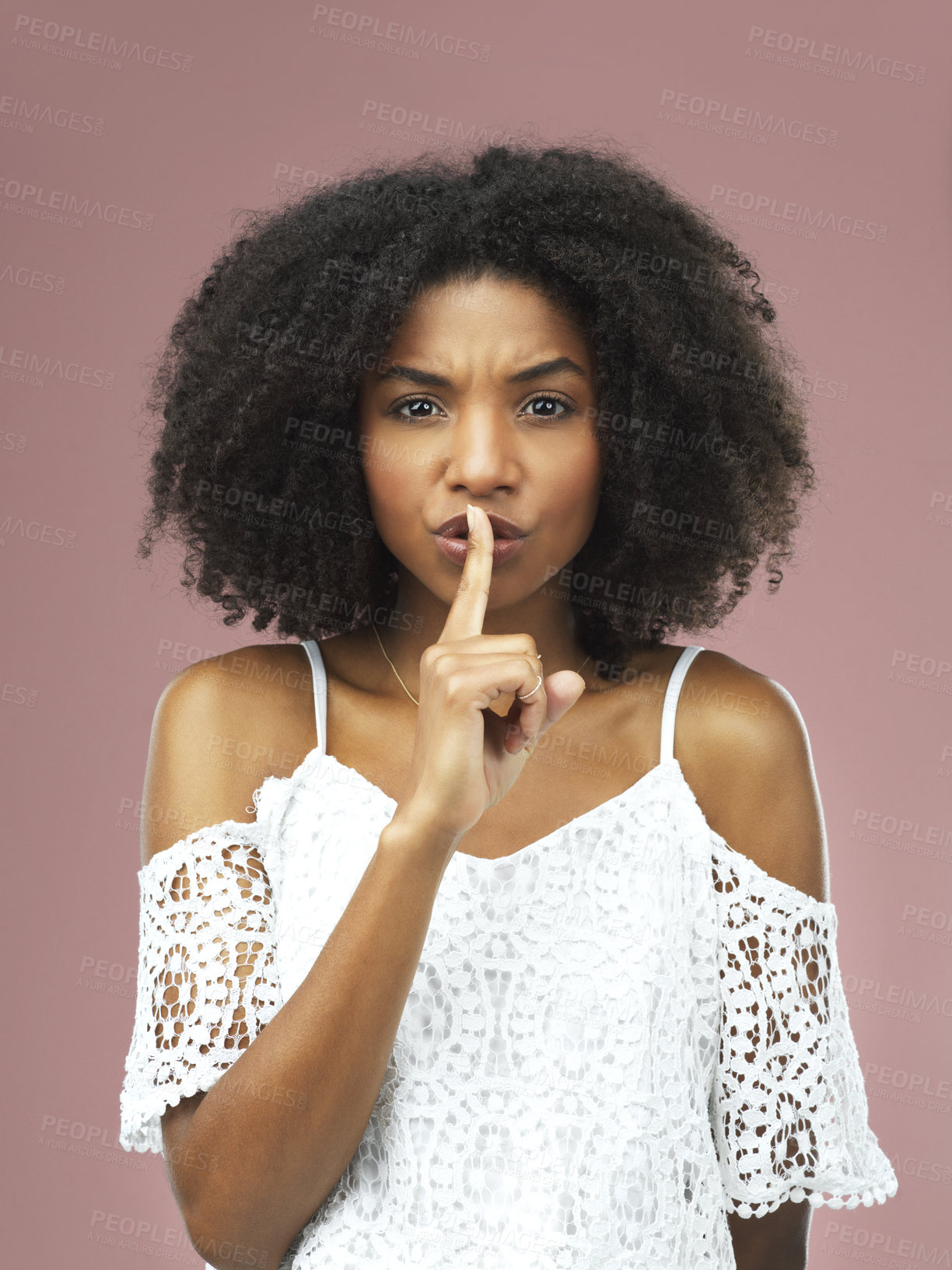 Buy stock photo Hush, portrait and serious with afro black woman in studio on pink background for secret, silent or whisper. Anger, gossip or warning and model with finger on lips for mystery, privacy or quiet