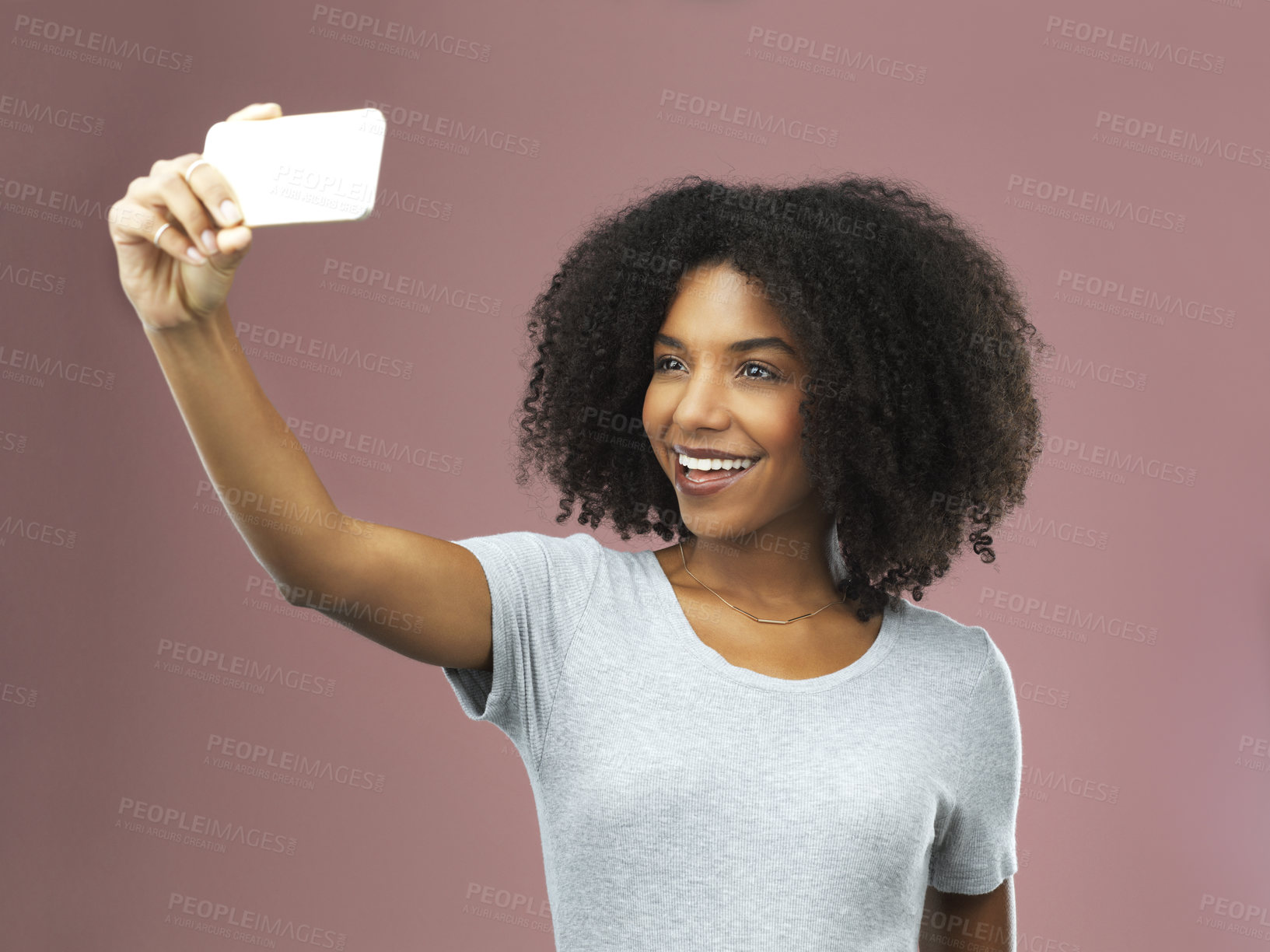 Buy stock photo Selfie, smile and female influencer in studio for social media, photography and status update on pink background. Black woman, happy and networking online for followers, communication and tech