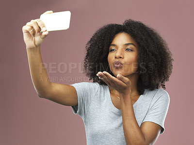 Buy stock photo Kiss, selfie and female influencer in studio for social media, photography and status update on pink background. Black woman, gesture and networking online for followers, communication and tech