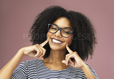 Buy stock photo Happy, woman and hand on face for dental care, oral hygiene and routine grooming isolated in studio. Excited, female person and smile with fingers on cheek for teeth, orthodontics and wellness