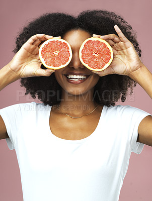 Buy stock photo Grapefruit, smile and black woman cover her eyes in studio isolated on a pink background. Natural, fruit and African female model with vegan nutrition, vitamin c or healthy diet, detox or wellness