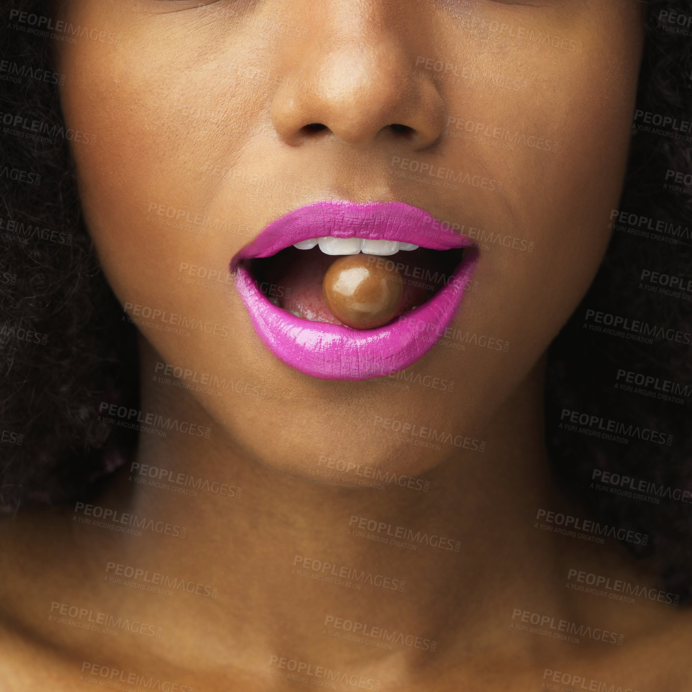 Buy stock photo Chocolate, lipstick and mouth with person biting sweet candy closeup for beauty or cosmetics. Ball, food and makeup with confident model eating cocoa snack for delicious delicacy or satisfaction