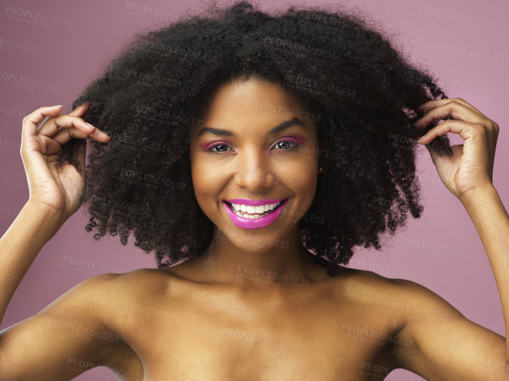 Buy stock photo Afro, haircare and face of black woman, makeup and studio for hairstyle, growth and texture of hair. Pink background, portrait and African girl with happiness for treatment in salon and hairdresser