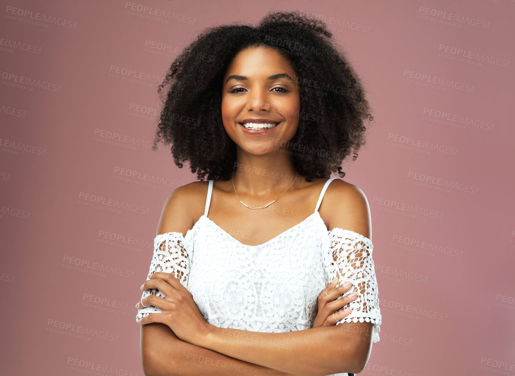 Buy stock photo Afro, fashion and portrait of black woman, confidence and smile for hairstyle, growth or texture. Pink background, arms crossed or African girl with happiness for treatment in studio, beauty or salon