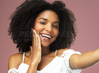 Buy stock photo Studio shot of a beautiful young woman posing with her hand on her cheek