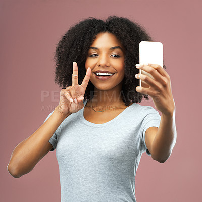 Buy stock photo Peace sign, selfie and social media with happy black woman in studio on pink background for profile picture. App, photograph or smile of afro influencer person with hand gesture for video call 
