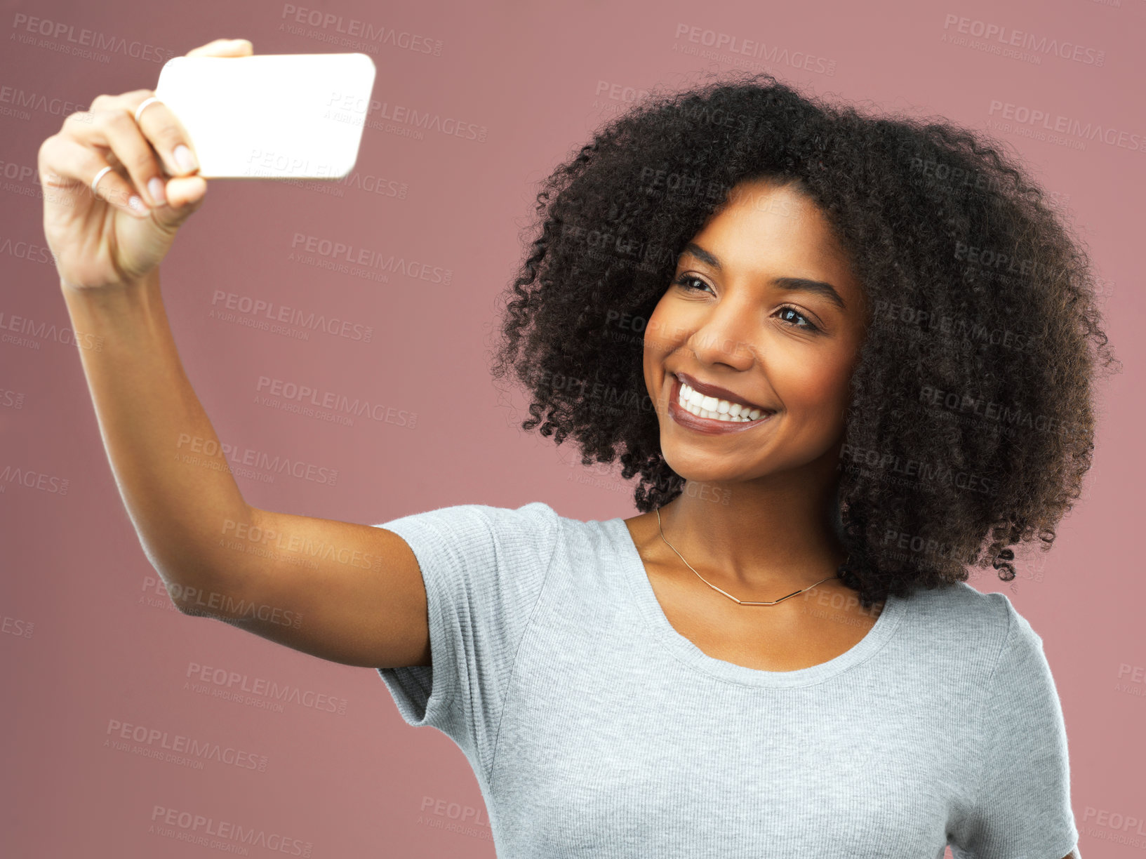 Buy stock photo Smile, selfie and female influencer in studio for social media, photography and status update on pink background. Black woman, happy and networking online for followers, communication and tech