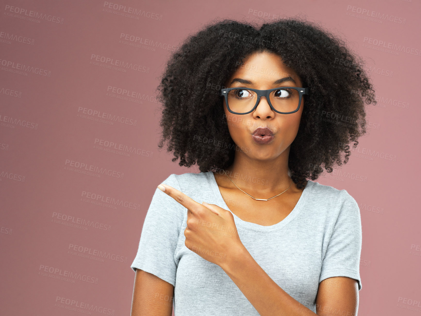 Buy stock photo Pointing, advertising and black woman in studio for marketing with announcement isolated on pink background. Afro, glasses and branding with gesture for mockup or promotion offer with discount deal.