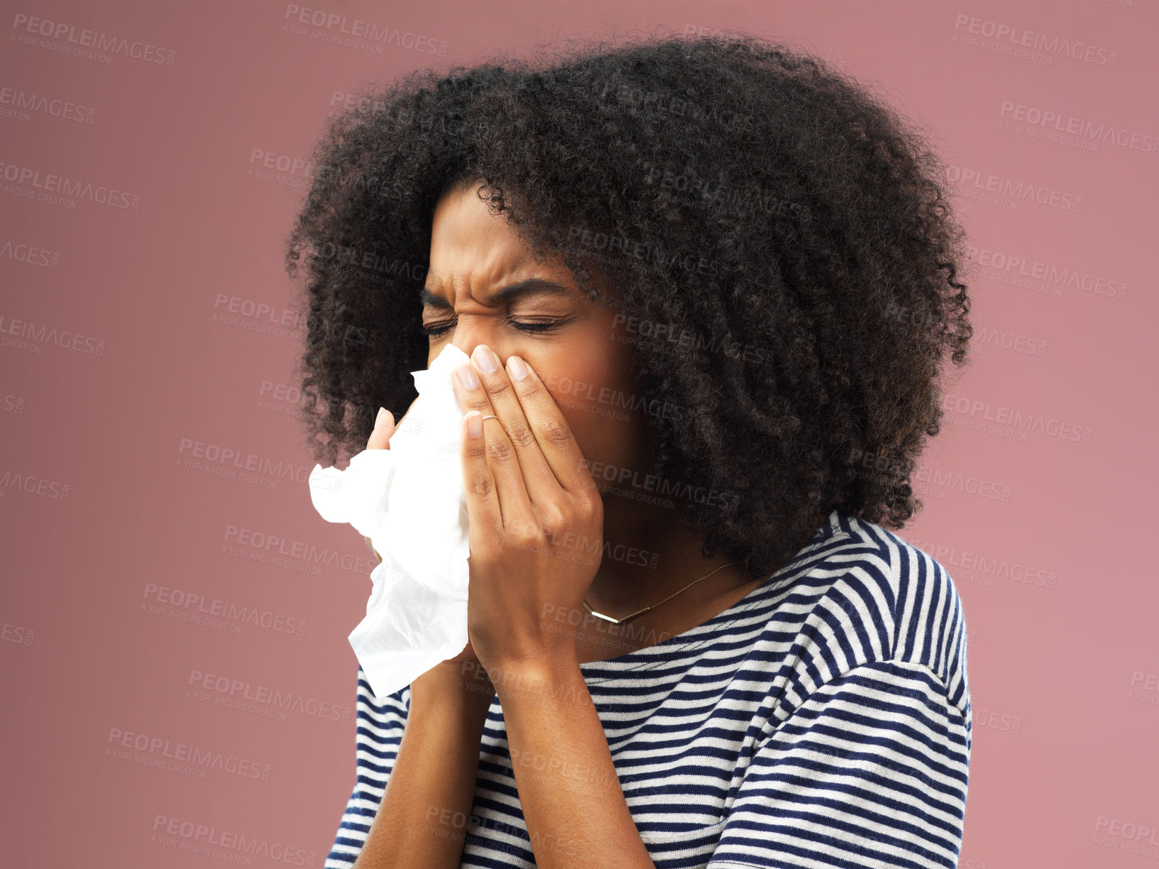 Buy stock photo Stress, tissue and sick girl in studio blowing nose for allergies, flu or covid emergency on pink background. Congestion, paper and face of gen z model with bacteria risk, bug or influenza disaster